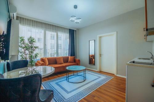 a living room with a couch and a glass table at Taksim Wonder Suites in Istanbul