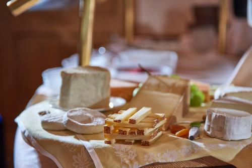 a table topped with food on top of a table at The Glacier Hotel - ex Eurotel Victoria - in Les Diablerets