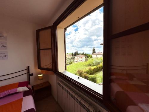 Postel nebo postele na pokoji v ubytování Appartamento nel chianti