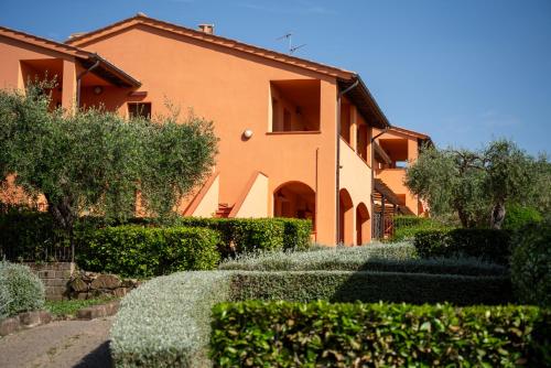 a house with a garden in front of it at Borgo Etrusco in Scarlino