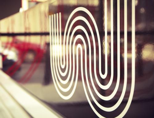 a close up of a white swirl pattern on a train at The Whitechapel in London