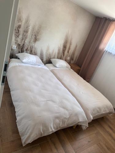 Katil atau katil-katil dalam bilik di Apartamenty W Domu DeLux