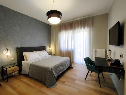 Postel nebo postele na pokoji v ubytování Agape Charme Rooms