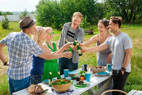 a group of people standing around a table with wine bottles at 松田テラスB Matsuda Terrace B in Matsuda