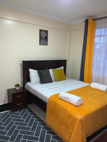 Giường trong phòng chung tại Trice Homes One Bedroom Condo at Lavender Apartment