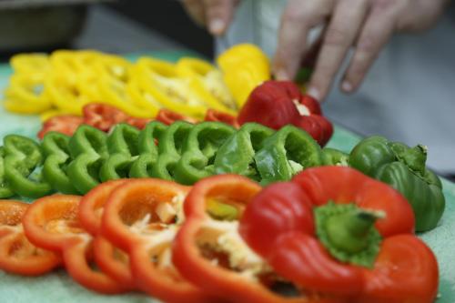 a pile of peppers and tomatoes on a table at Portaluna Hotel & Resort in Jounieh