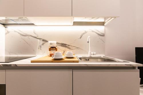 Kuchyň nebo kuchyňský kout v ubytování MAMELI HOME - M4 Tricolore