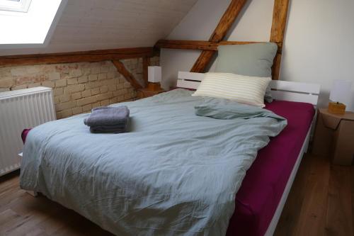 a large bed in a room with at Naturgarten Karlsfeld in der schönen Lausitz in Welzow