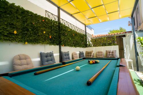 a pool table with bowling balls on it at The DreamHouse Athens Airport in Artemida
