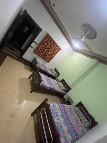 an overhead view of three stairs in a house at Safari Hotel in Dera Ghāzi Khān