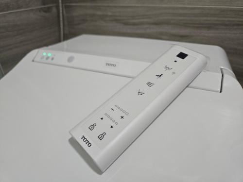 a wii remote control sitting on top of a table at 眠極文旅-無人化民宿 臺東縣民宿2110號 in Taitung City