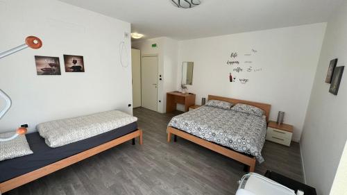 Postel nebo postele na pokoji v ubytování B&B DIVINO