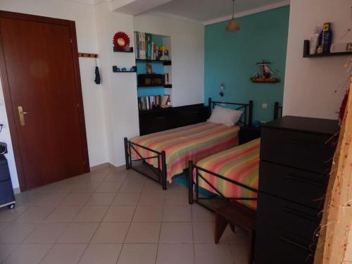 a bedroom with two beds in a room at Seafront dream Villa, Ierissos in Ierissos