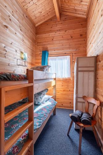 Postel nebo postele na pokoji v ubytování Chalet 16 pâquerette