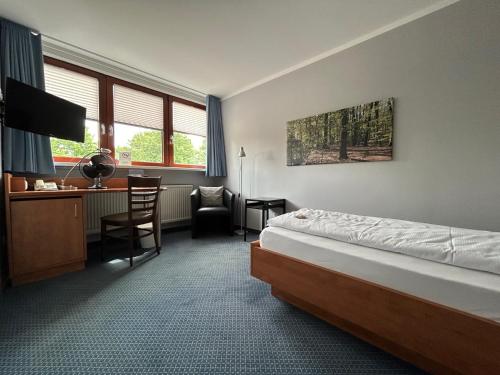Postel nebo postele na pokoji v ubytování Hotel & Restaurant Prüser´s Gasthof