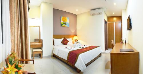 מיטה או מיטות בחדר ב-Do Hai Hotel