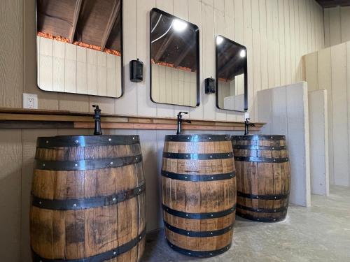 a row of wooden barrels in a room with mirrors at Canyon Lakeview Resort in Canyon Lake