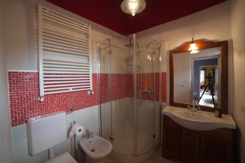 a bathroom with a shower and a sink and a toilet at All'Antico Convento in Cannero Riviera