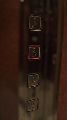 a close up of the buttons of a microwave oven at Orfeas apartment in Tripolis