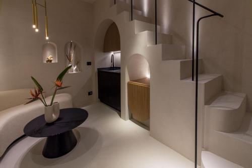 a bathroom with a shower and a table and stairs at Pànto - Rooftop boutique rooms in Palermo