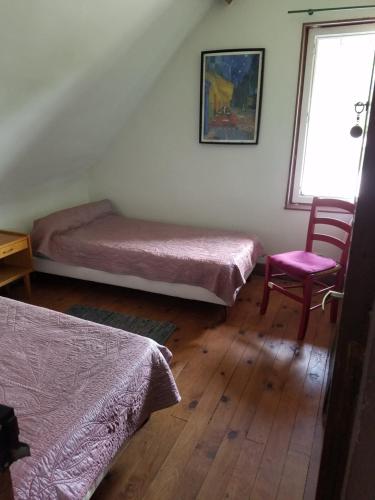 Katil atau katil-katil dalam bilik di Le vieux pré de la motte