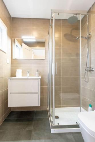 a bathroom with a shower and a sink at City Center Apartments-Penafiel in Penafiel