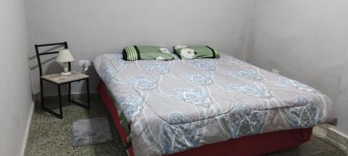 Ліжко або ліжка в номері Viviendas Gonzalez