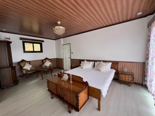 Giường trong phòng chung tại Yuj Inn - Benguet