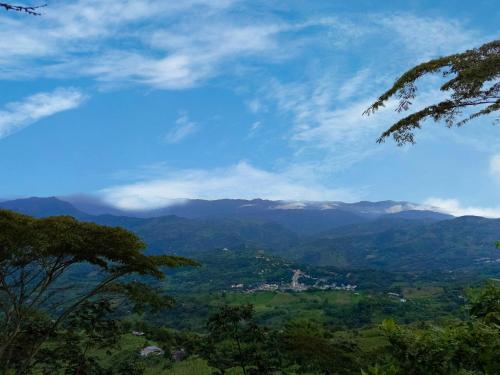 a view of a valley with mountains in the distance at Glamping eco descanso la vega Nocaima in Nocaima