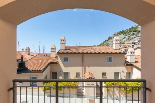 a view from a balcony of a building at Portopiccolo Apartments in Sistiana