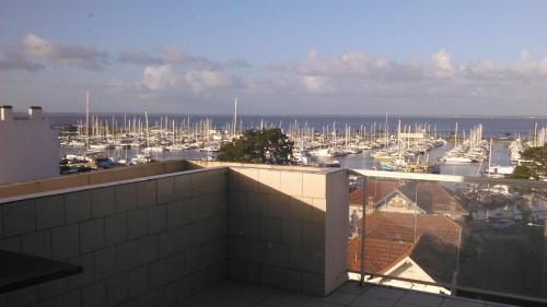 a view of a marina with boats in the water at Hôtel Le Nautic in Arcachon