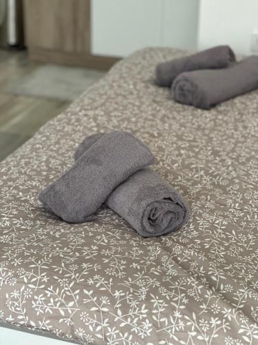 two towels sitting on top of two beds at MELIORA Apartment in Belgrade