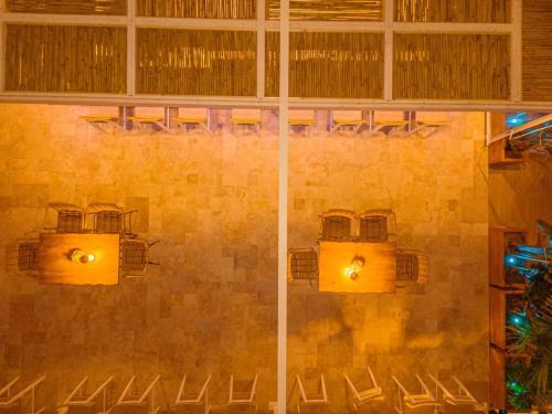 a room with chairs and a wall with lights at Ionion Beach Resort in Parga