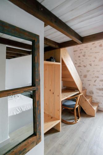 a room with bunk beds and a mirror at Militiko in Himare