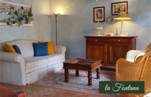 a living room with a couch and a coffee table at Il Borghetto Vacanze nei Mulini in Valeggio sul Mincio
