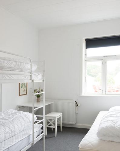 Cama o camas de una habitación en Nordliv Strand