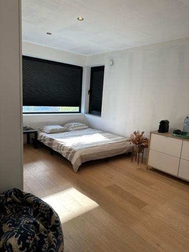 Postel nebo postele na pokoji v ubytování Kamer in hartje van de Vlaamse Ardennen