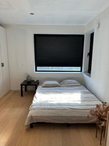 Postel nebo postele na pokoji v ubytování Kamer in hartje van de Vlaamse Ardennen