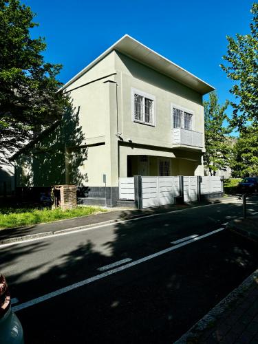 a white house on the side of a street at Villa Life in San Donato Milanese