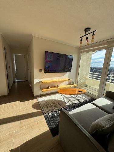 Μια τηλεόραση ή/και κέντρο ψυχαγωγίας στο Departamento nuevo excelente ubicación cómodo y amplió de 1 a 4 personas con estacionamiento