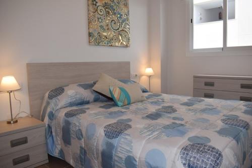 Ένα ή περισσότερα κρεβάτια σε δωμάτιο στο Residencial Blaumar Piles Playa