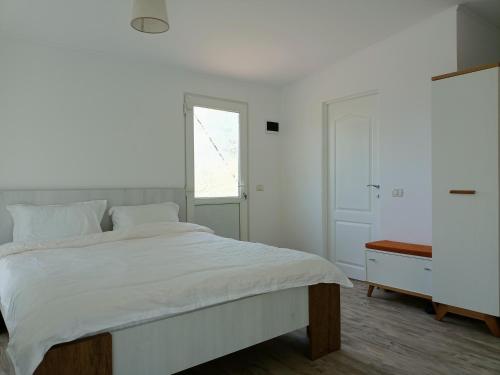 Postel nebo postele na pokoji v ubytování Greci GuestHouse