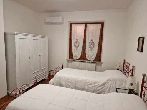 Llit o llits en una habitació de Habitat - Casa Vacanze Perugia