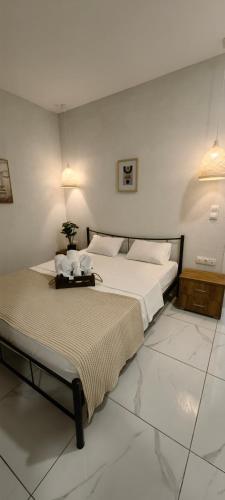a bedroom with a large bed in a room at TOPAZ four in Siviri