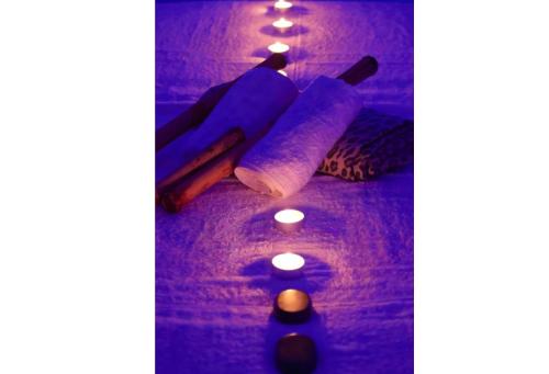 a group of candles and some lit up candles at PICCOLO PARADISO Suite LUNA in Scafa