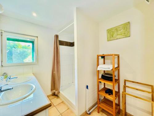 a bathroom with a sink and a shower at Gite Moun Mazet in Miramas