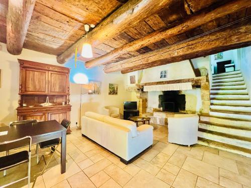 a living room with a couch and a fireplace at Le Moun Mazet gîte rural 3 étoiles, CLIM, Nature, 6 personnes in Miramas