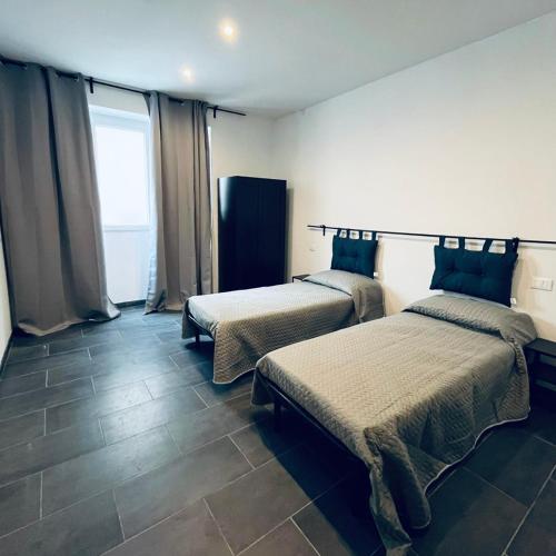 Postel nebo postele na pokoji v ubytování Esterina Rooms