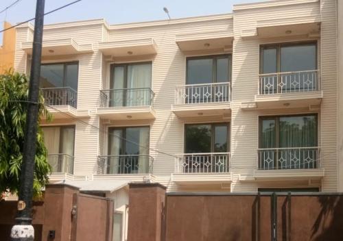 a building with balconies on the side of it at UDS Villa - Next to VFS, Walking to Connaught Place in New Delhi