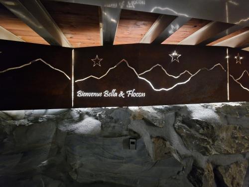 a sign that says someone built a fireplace at Bella Flocon appartements min 2 Nights Special weekly and monthly prices in Savièse